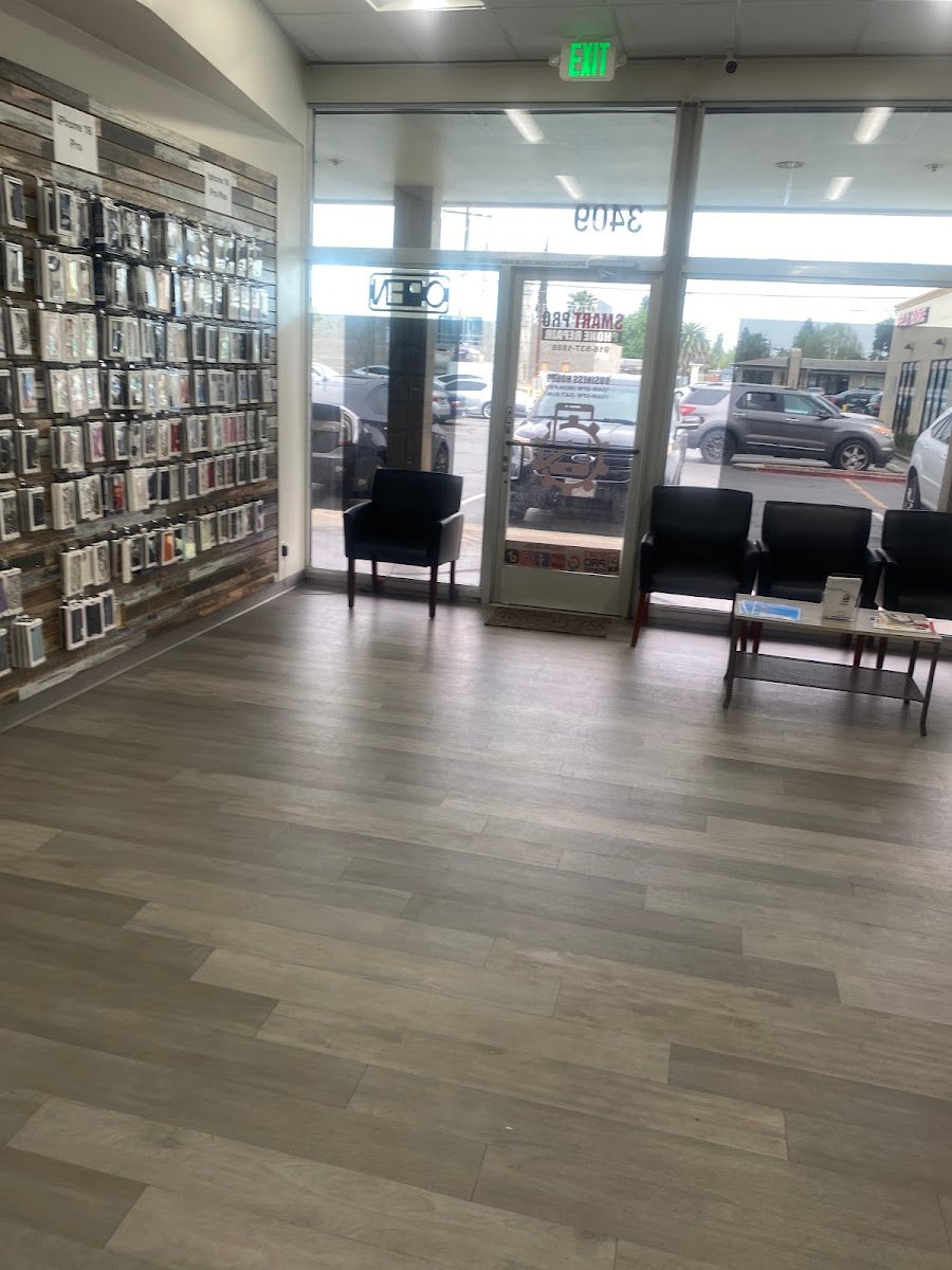 Inside the shop — wall of phone cases and the customer waiting area